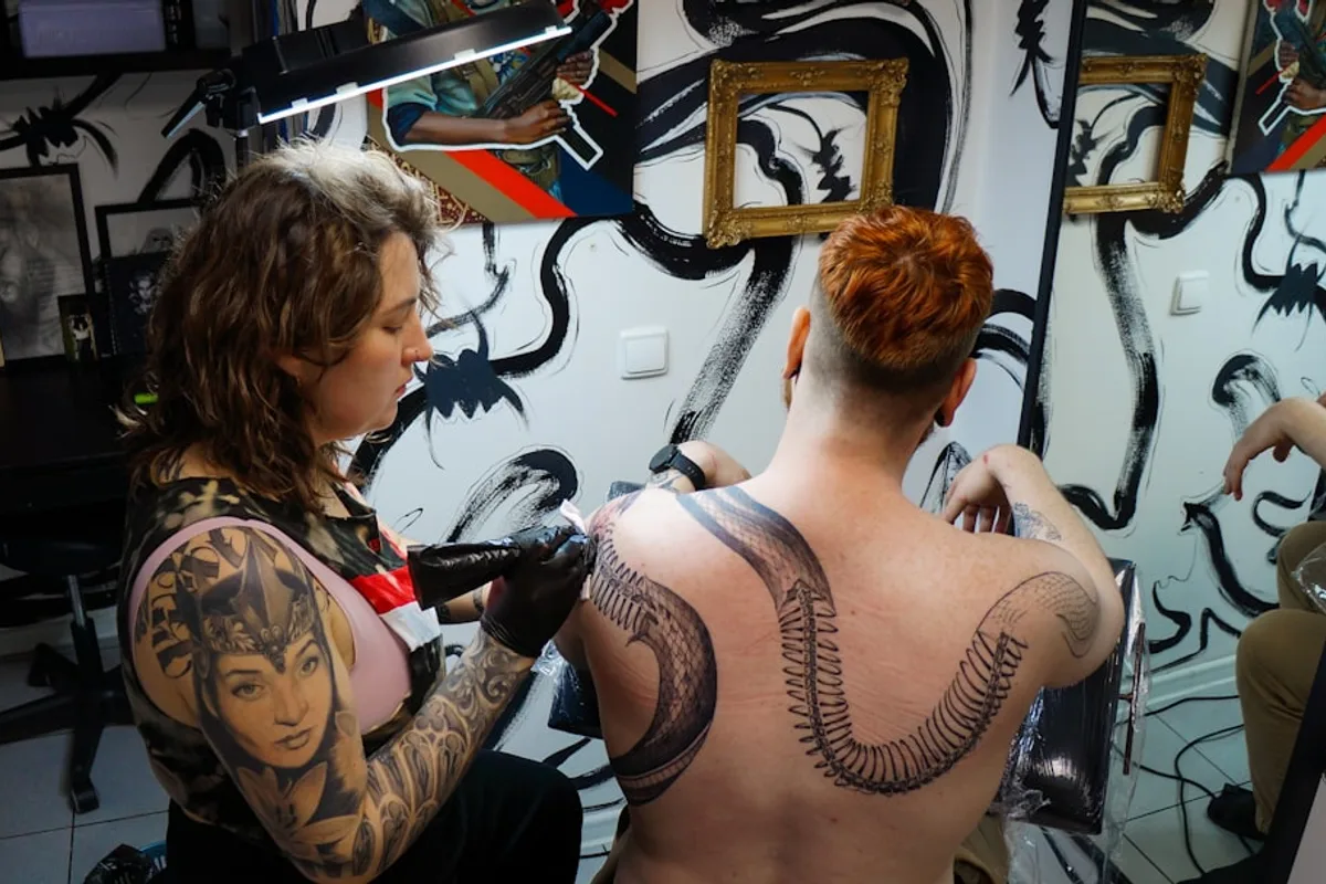 a man and woman with tattoos