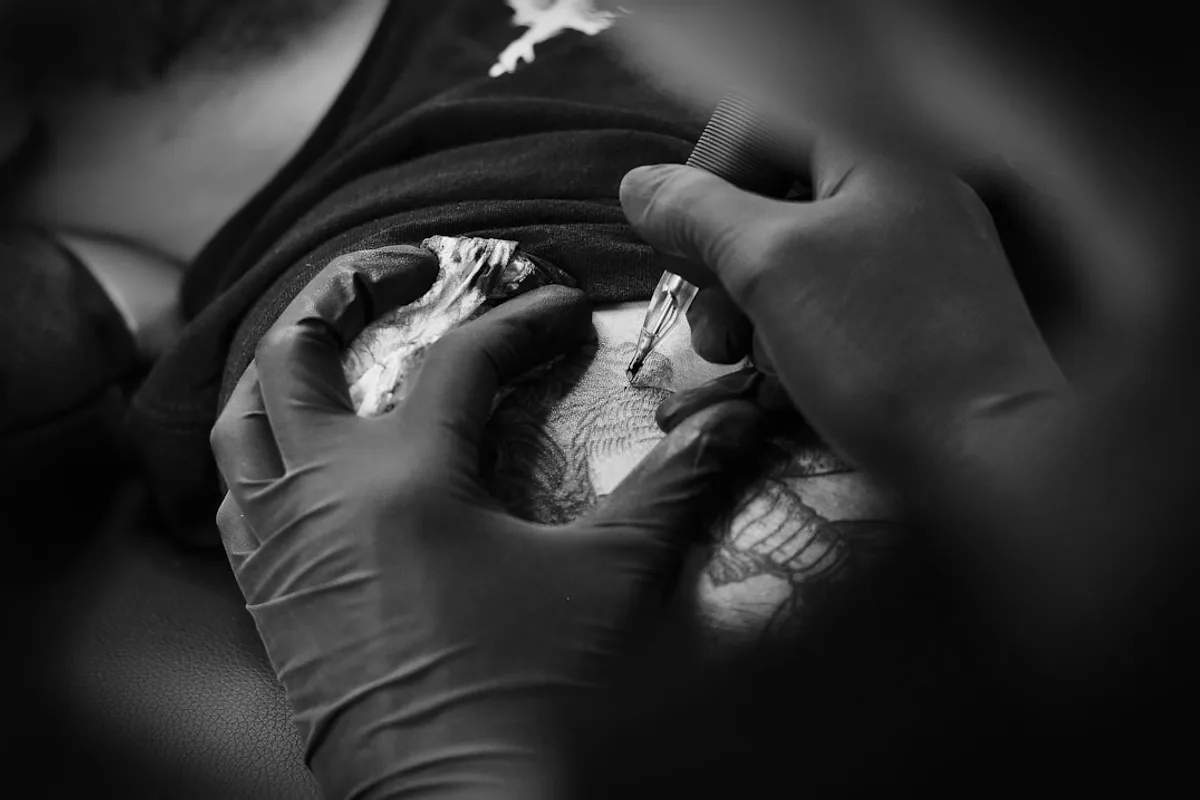 a person holding a needle