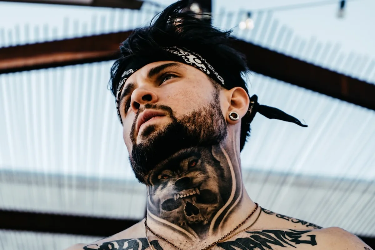 aman with wolf tattoo