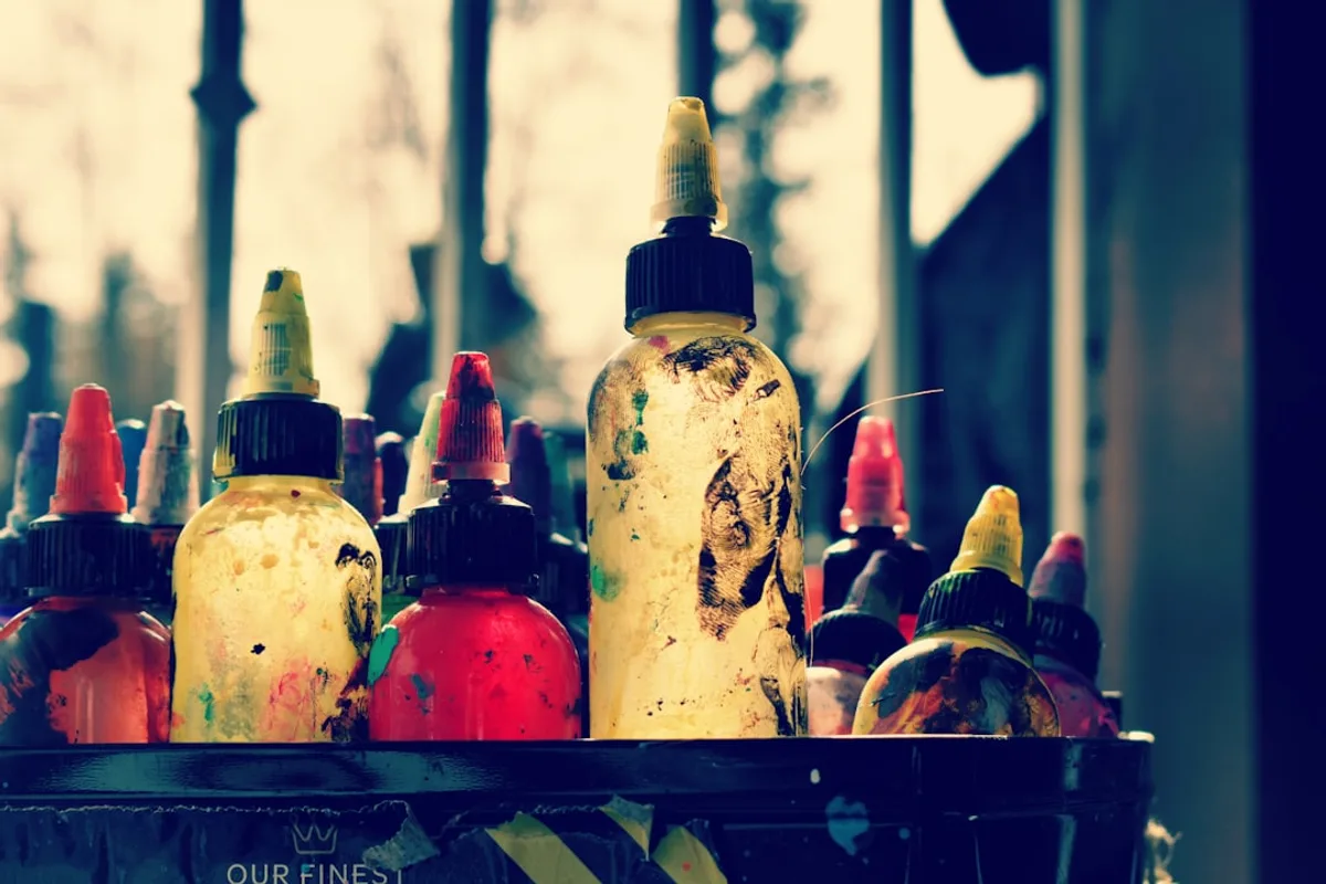 Bottles of colorful ink in a holder