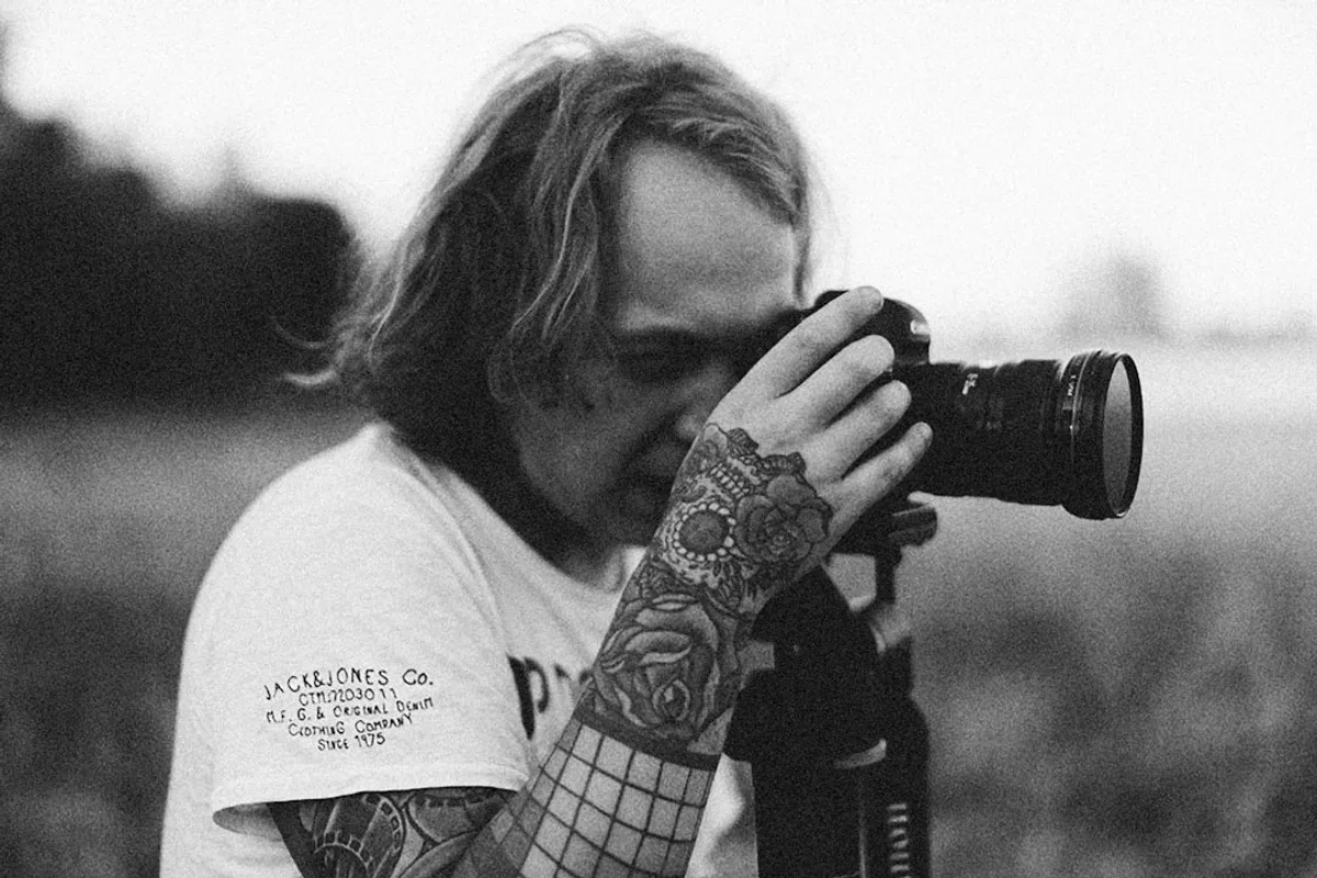 a man taking a picture with a camera