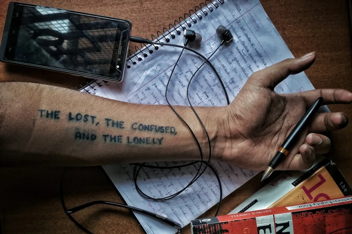 man holding black pen