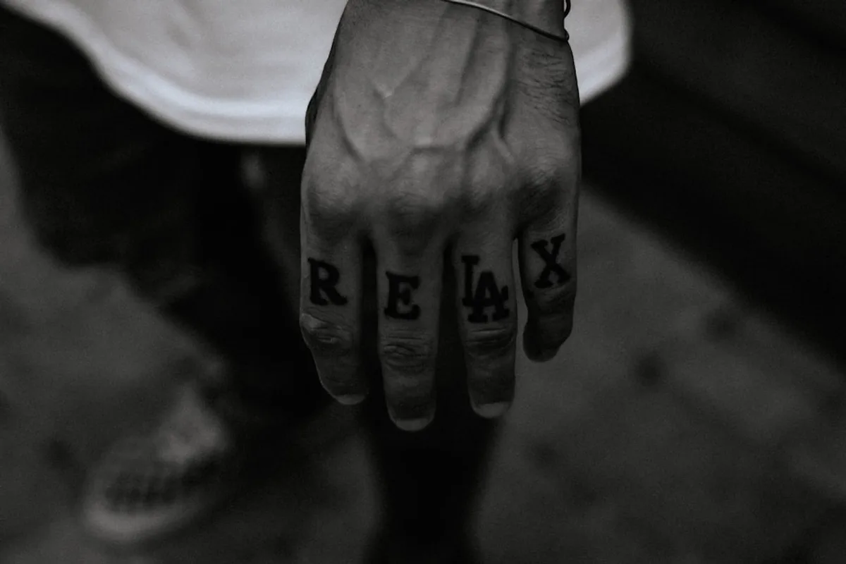 grayscale photo of persons hand