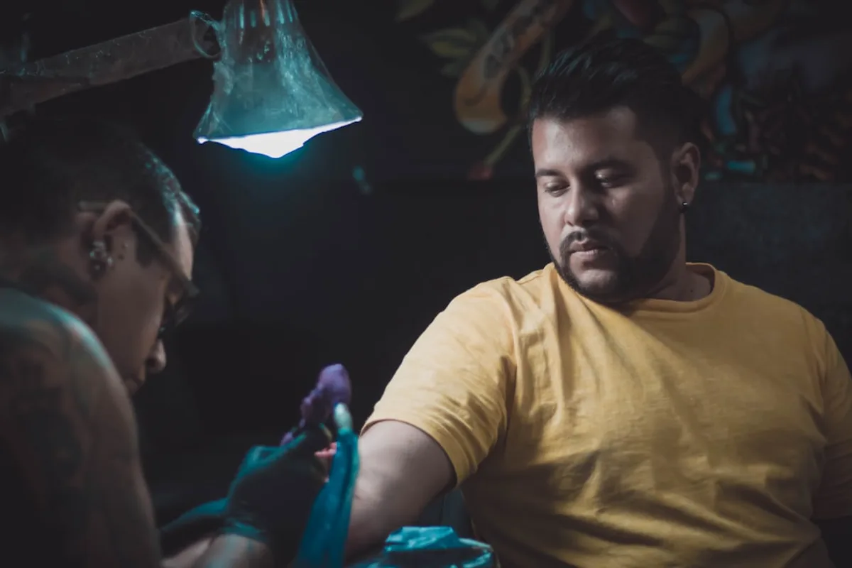 man in yellow crew neck t-shirt